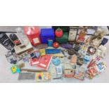 A mixed lot to include advertising items, playing cards, tins, cigarette cases, ornaments, a