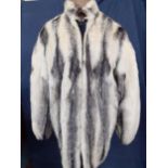 A 1970's Joseph the Furrier white and black cross mink jacket with zipped fastening and