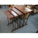 A reproduction mahogany nest of four tables, largest 70cm h x 56cm w Location: