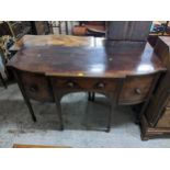 A George III mahogany sideboard with two drawers and a door, on square tapered legs Location:
