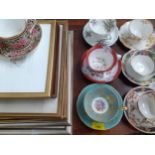 A collection of decorative teacups and saucers to include Aynsley, Minton and Crown China and