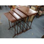 A reproduction mahogany nest of four tables, largest 70cm h x 56cm w Location: A1F