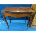 A reproduction mahogany serpentine fronted fold over card table on cabriole legs, 76.5cm h x 84.