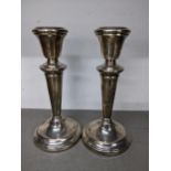 A pair of mid 20th century weighted silver candlesticks hallmarked London 1955, 16cm h Location:
