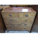 A late George III mahogany flat fronted chest of two short and three long graduated drawers on