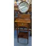 An early 20th century mahogany shaving stand with a mirror over a drawer Location: