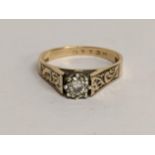 A 9ct gold diamond ring in a claw setting and engraved shoulders, 3.2g Location: