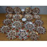 Royal Crown Derby Imari pattern china to include 15 plates and another copy, together with a cup and