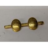 A 9ct gold bar brooch with two roundels engraved with initials, 6.3g Location: