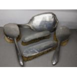 An early 20th century silver five-piece dressing table set Location: