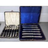An early 20th century cased set of silver handled butter knives Sheffield 1934, together with a