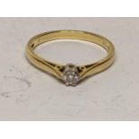 A 18ct gold ring inset with a single diamond, 2.7g Location: