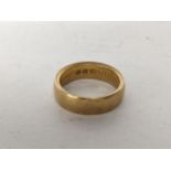 A 18ct gold wedding band, 6.6g Location:
