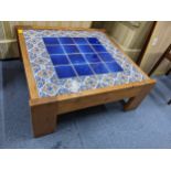 A vintage pine and tile topped coffee table Location:
