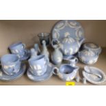 A quantity of Wedgwood blue Jasper ware to include a teapot on stand, vases and six teacups with