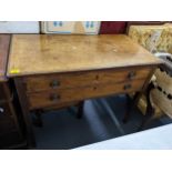 An early 19th century mahogany side table having two drawers and on squared tapering legs, 74cm x