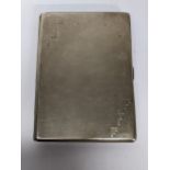 An early 20th century silver cigarette case by Walker and Hall, hallmarked Sheffield 1931, 149.9g