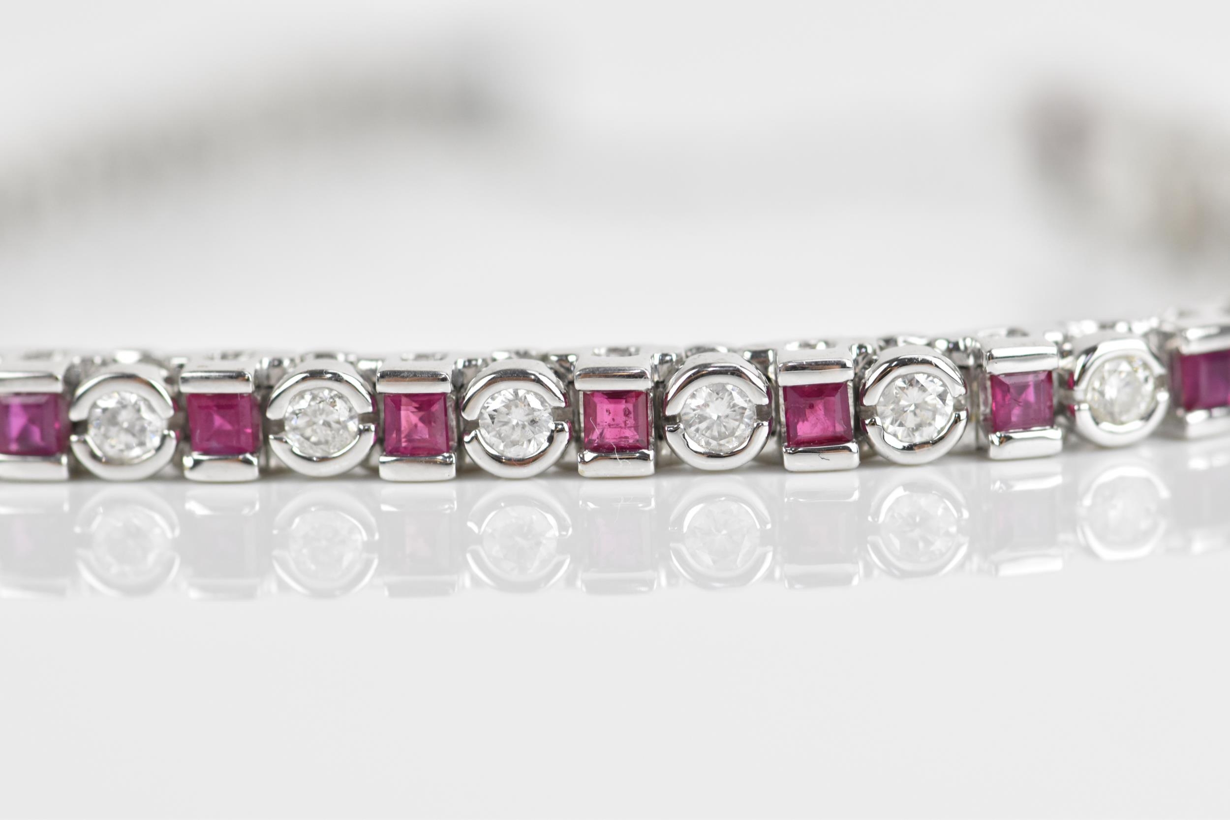 An 18ct white gold, diamond and ruby bracelet, with alternating round brilliant cut diamond and - Image 5 of 8