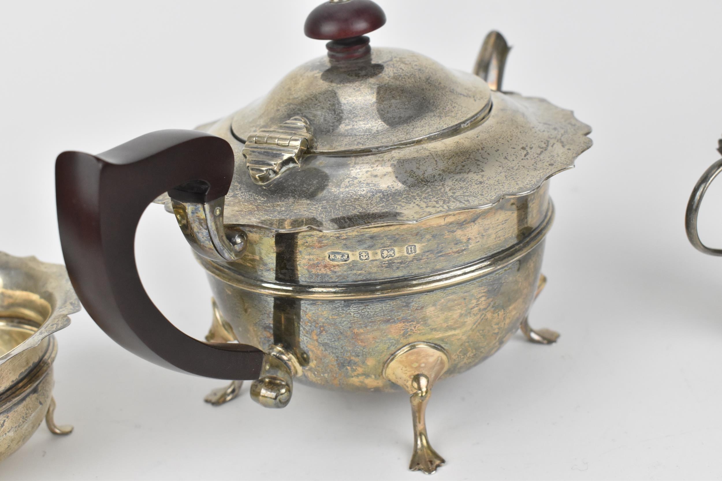 A George V silver three-piece tea set by Robert William Jay, Birmingham 1932, comprising a teapot, - Image 5 of 5