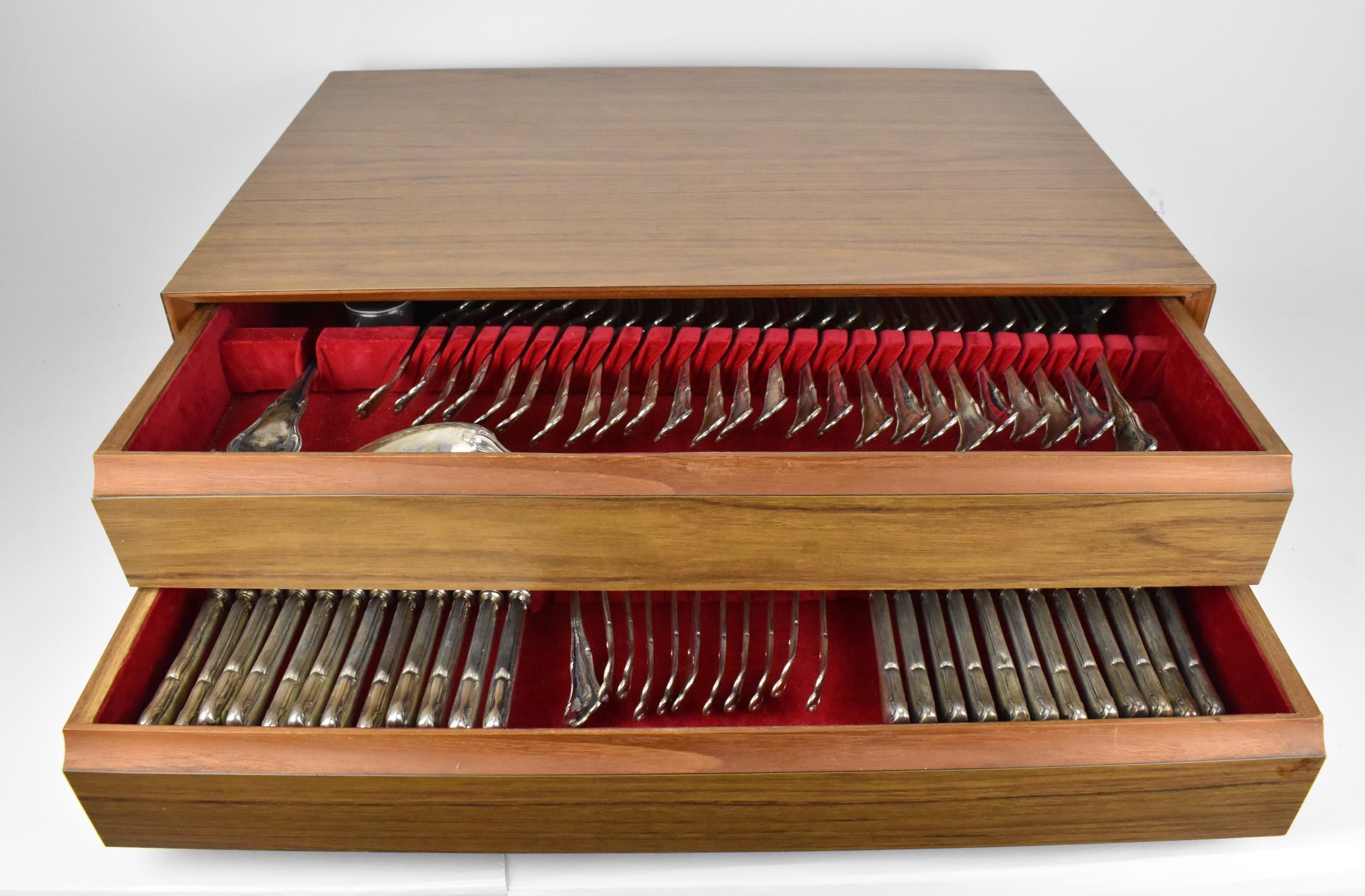 A Continental silver canteen of cutlery for eleven setting, consisting of two drawers comprising: