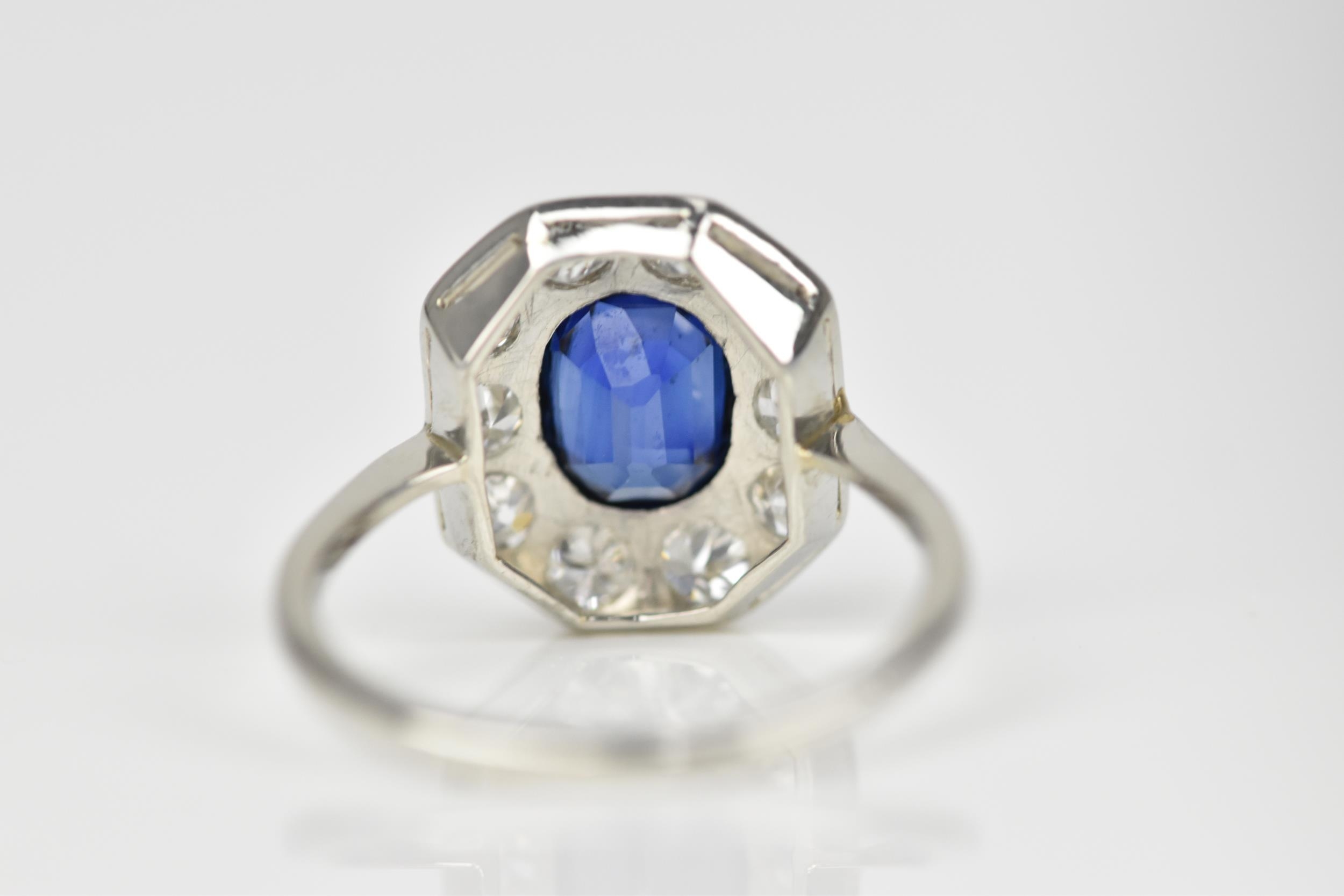 An Art Deco platinum, diamond and sapphire dress ring, the central deep blue sapphire in a - Image 3 of 6