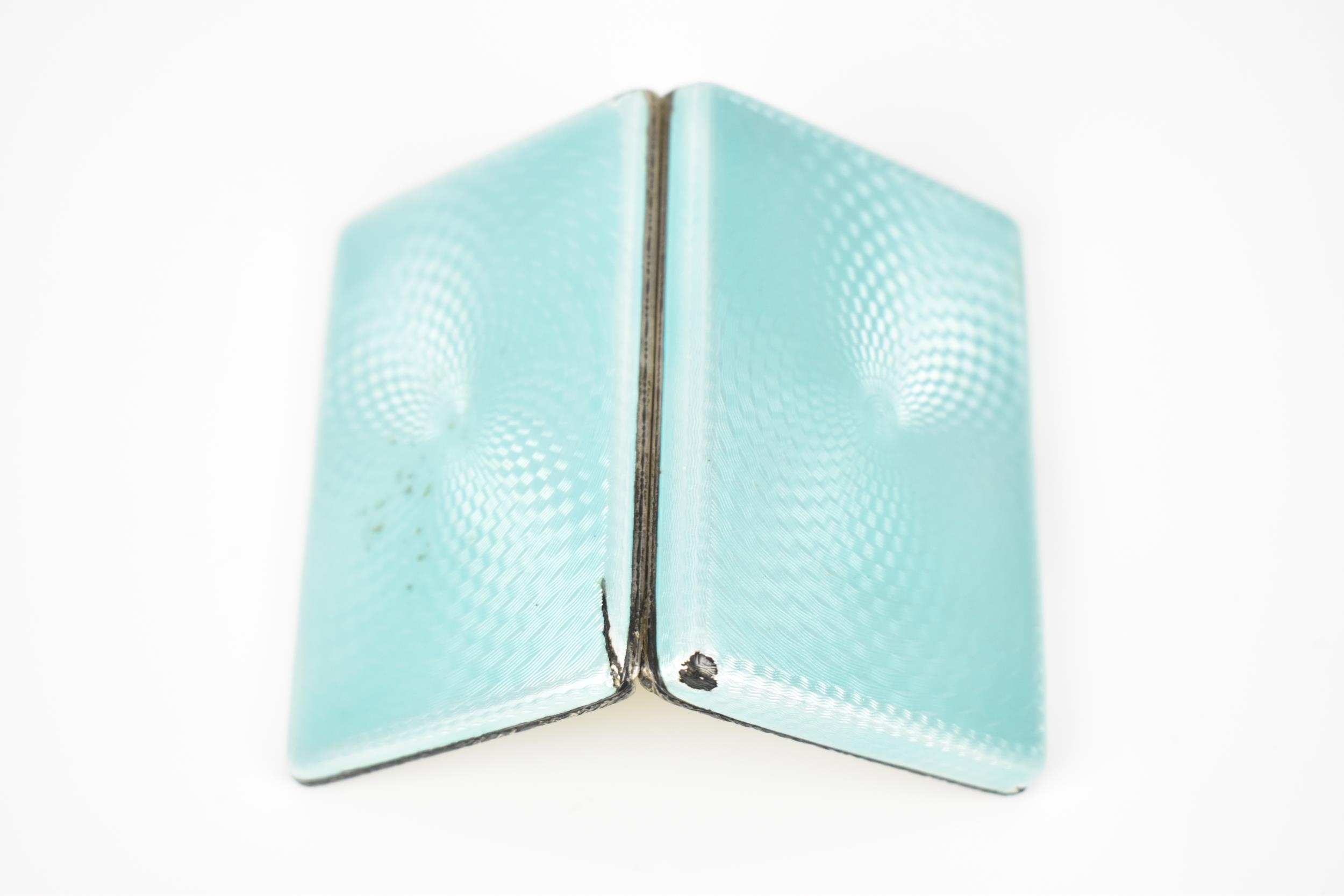 An Art Deco enamelled silver cigarette case, the exterior with engine turned ice blue enamel, with - Image 6 of 7