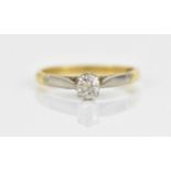 A yellow and white metal solitaire diamond ring, size P, weight 3.2 grams