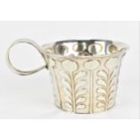 An Edwardian silver cup by Skinner & Co, London 1906, with embossed stylised floral design to the