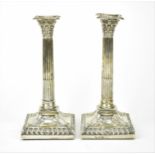 A pair of George III silver candlesticks by William Collings, London 1770, of tapered fluted form