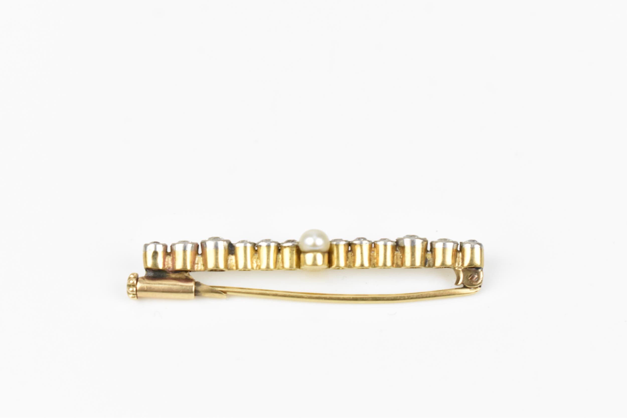 A yellow and white metal, diamond and pearl bar brooch, designed with twelve various sized rub- - Image 3 of 5