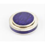 A modern British silver and enamel pill box, of circular form with purple wave pattern to the