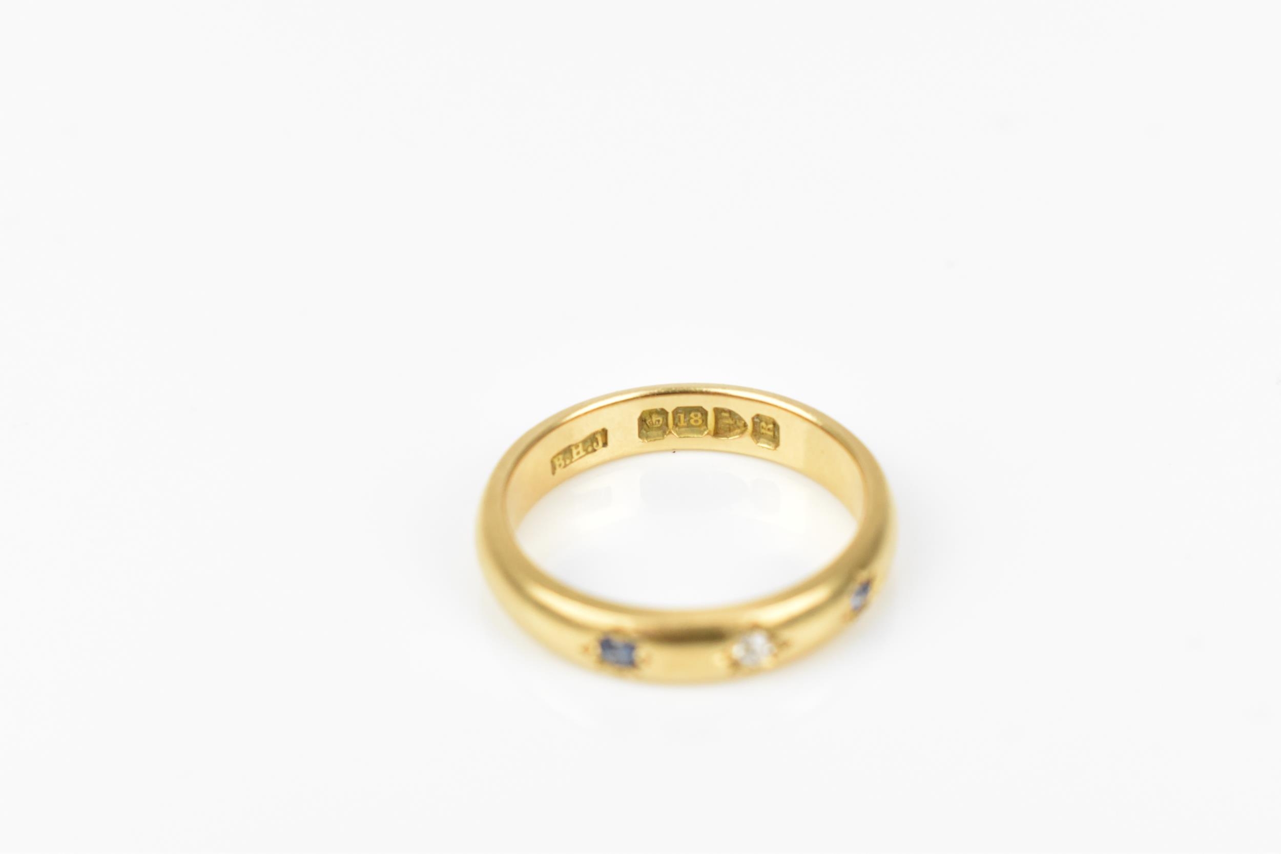 An 18ct yellow gold, diamond and sapphire gypsy ring, set with a central old cut diamond flanked - Image 3 of 4