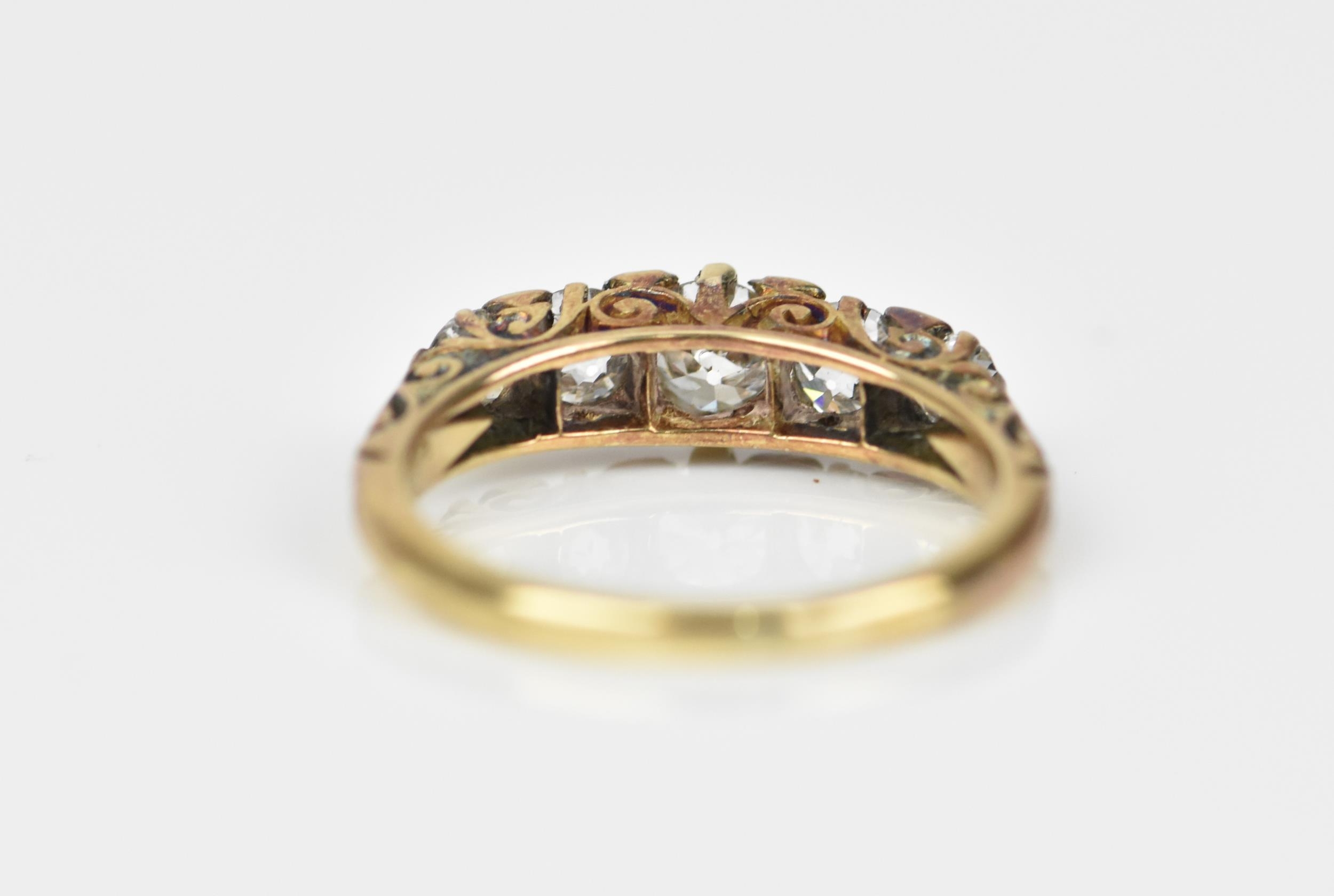 A yellow metal and five stone diamond ring, set with graduated old European cut stones, the - Image 5 of 6