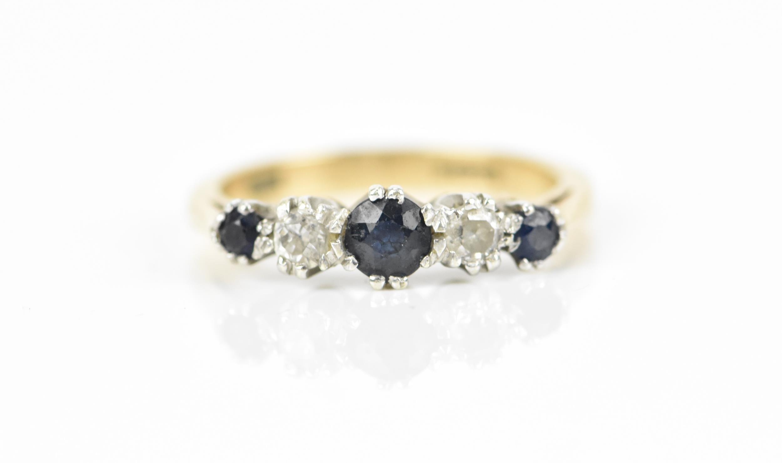 A 9ct yellow gold, diamond and blue sapphire five stone ring, designed with alternated and graduated