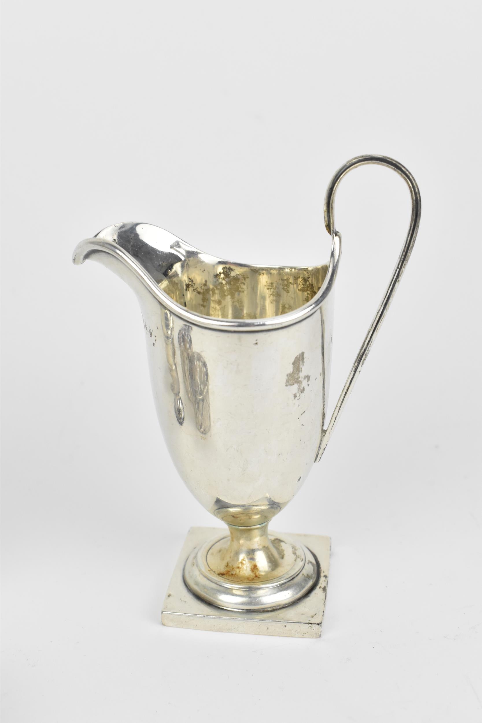 A small collection of silver, to include an Edwardian silver milk jug, a pair of Victorian pepper - Image 4 of 9