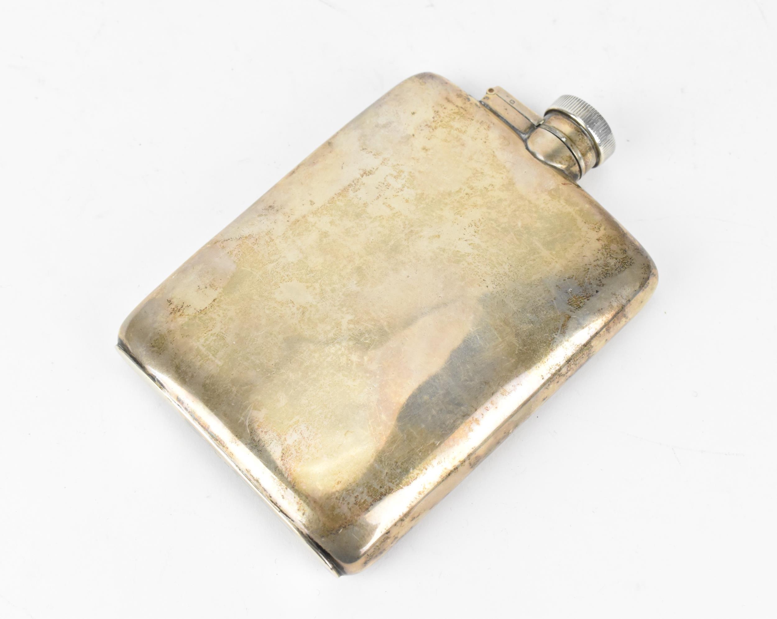 A George V silver hip flask by William Neale & Son Ltd, London 1929, of slight curved form with