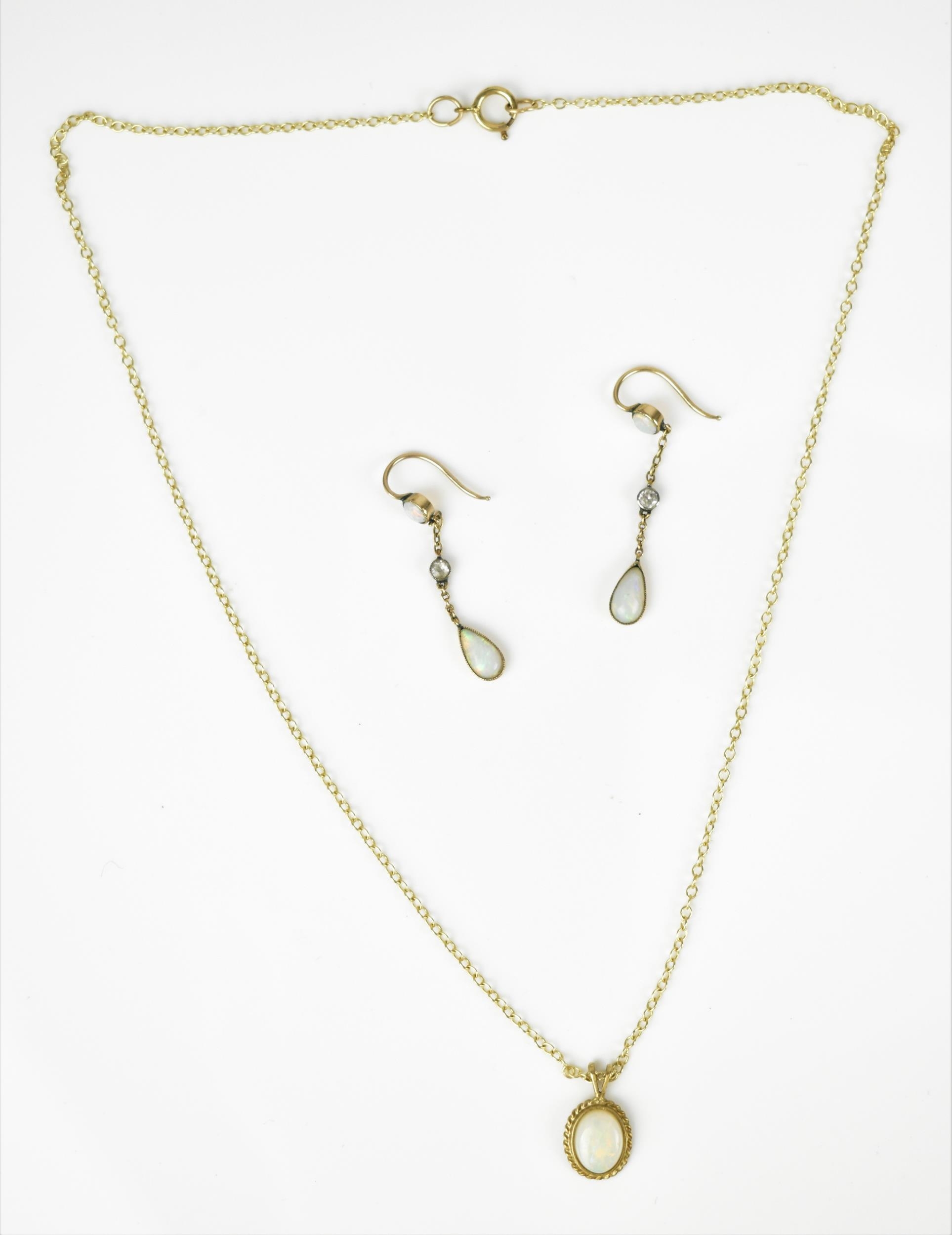 A 9ct yellow gold and opal necklace and earrings, with cable link, the cabochon white/red flash opal