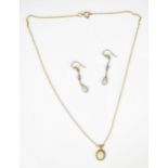 A 9ct yellow gold and opal necklace and earrings, with cable link, the cabochon white/red flash opal