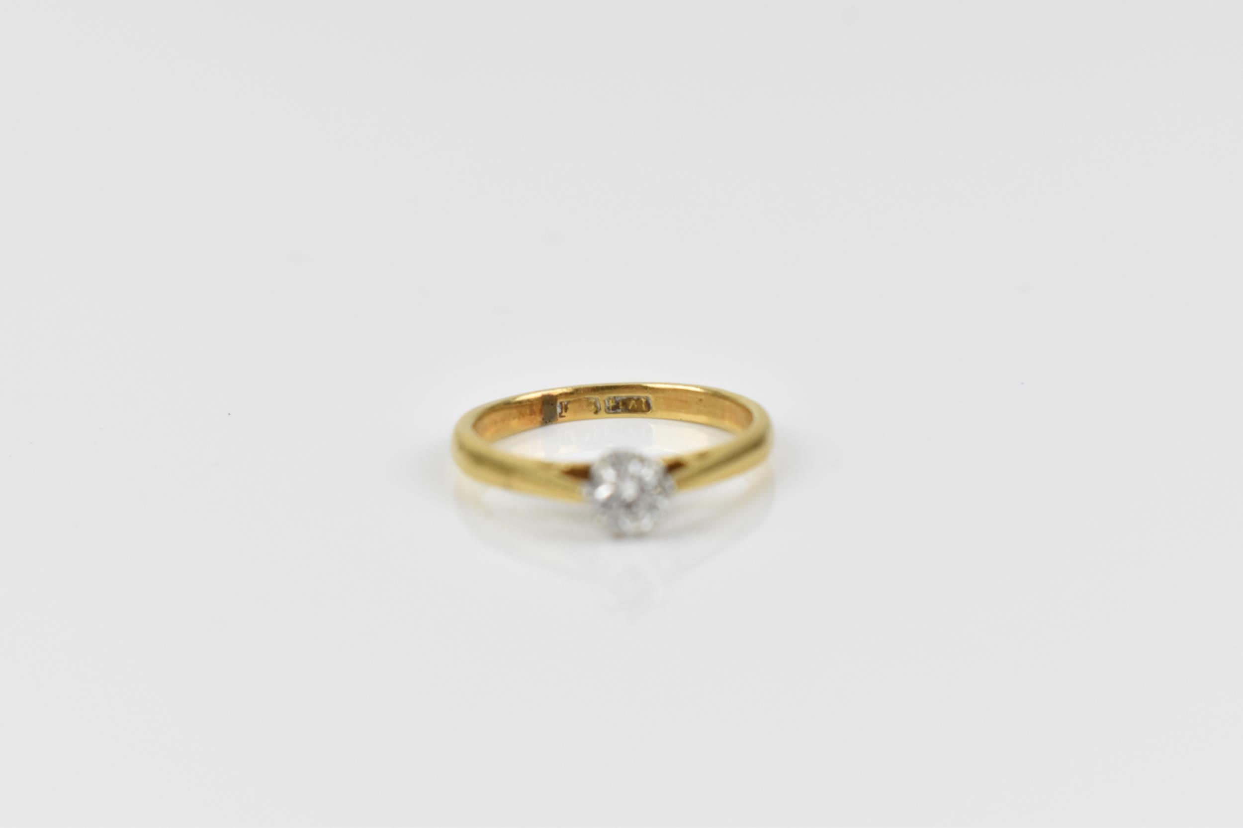 An 18ct yellow gold, platinum and diamond solitaire ring, the brilliant cut stone set in an eight - Image 3 of 6