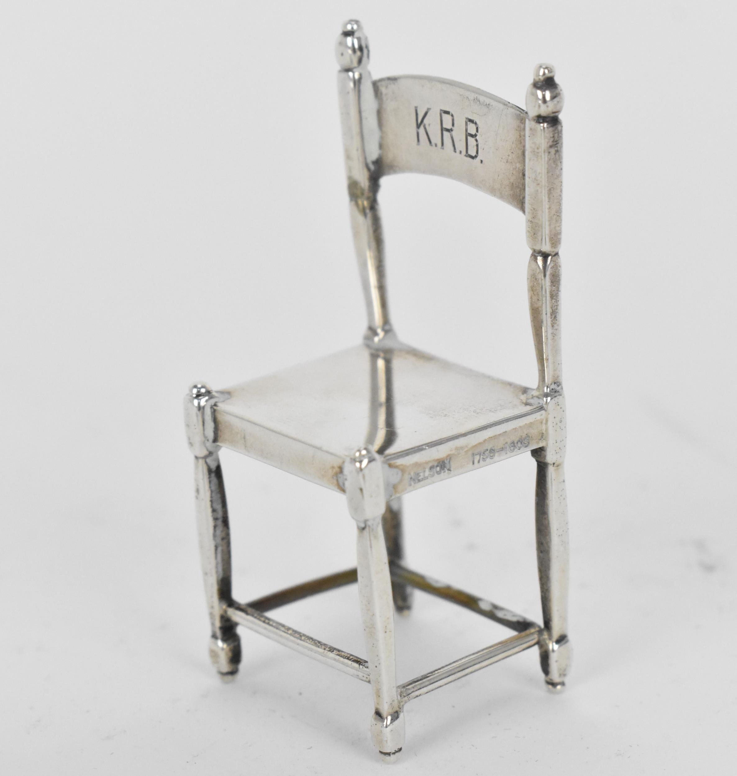 A small collection of silver and white metal miniature doll house furniture, to include a silver - Image 6 of 8