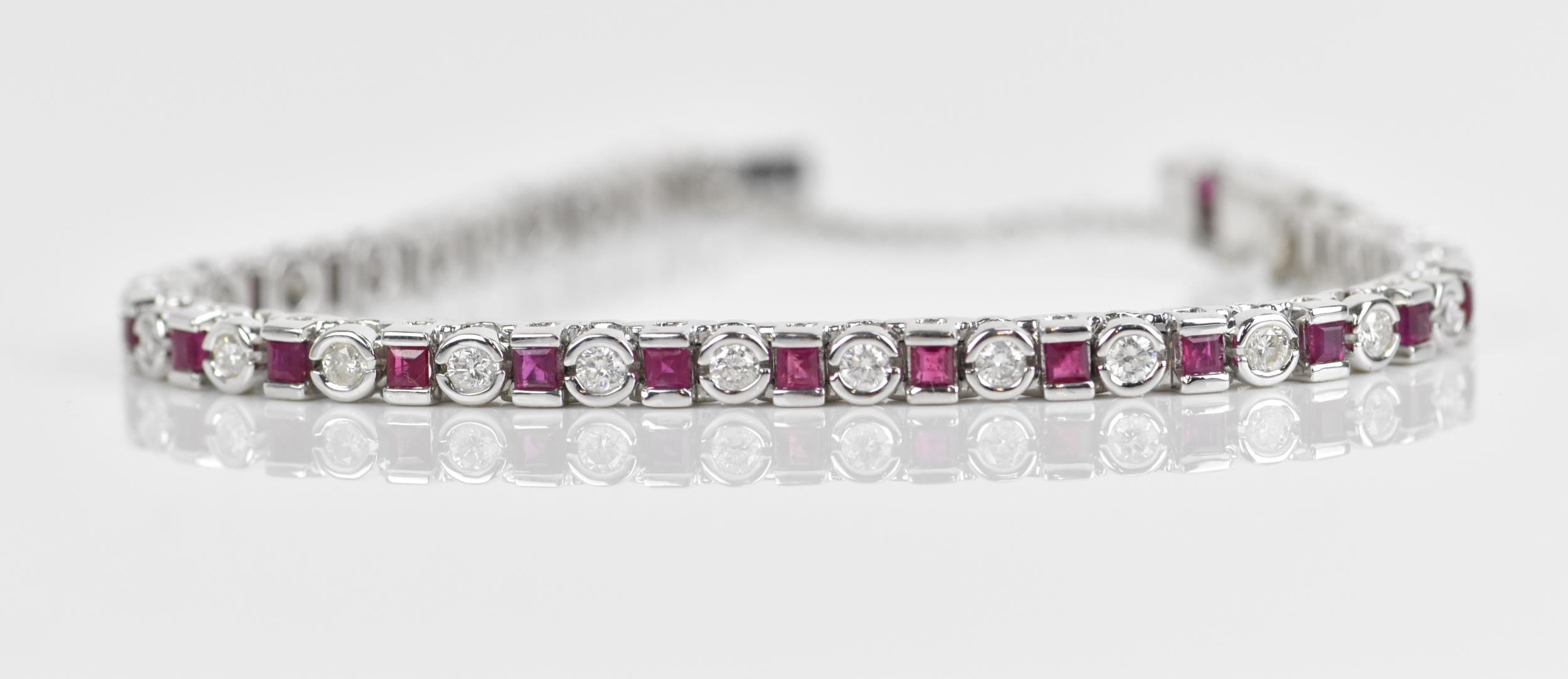 An 18ct white gold, diamond and ruby bracelet, with alternating round brilliant cut diamond and - Image 4 of 8