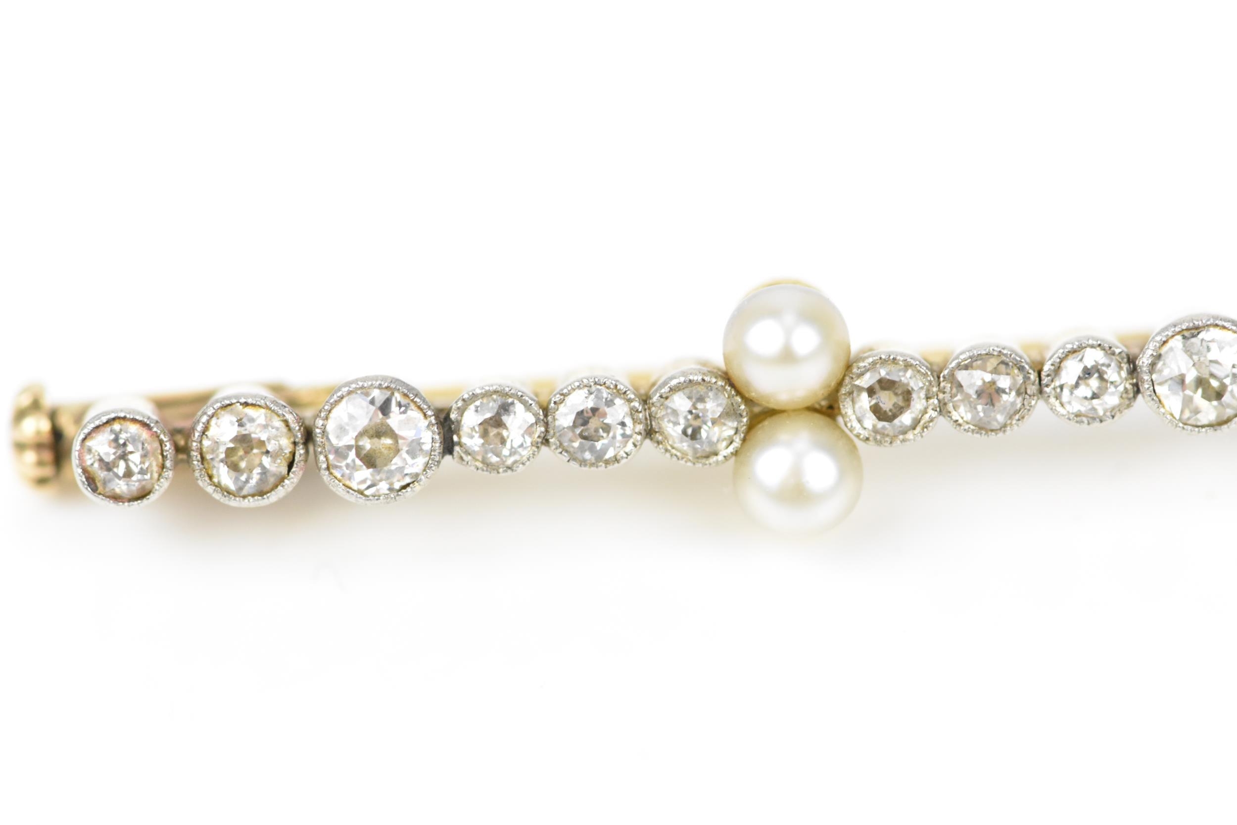 A yellow and white metal, diamond and pearl bar brooch, designed with twelve various sized rub- - Image 5 of 5