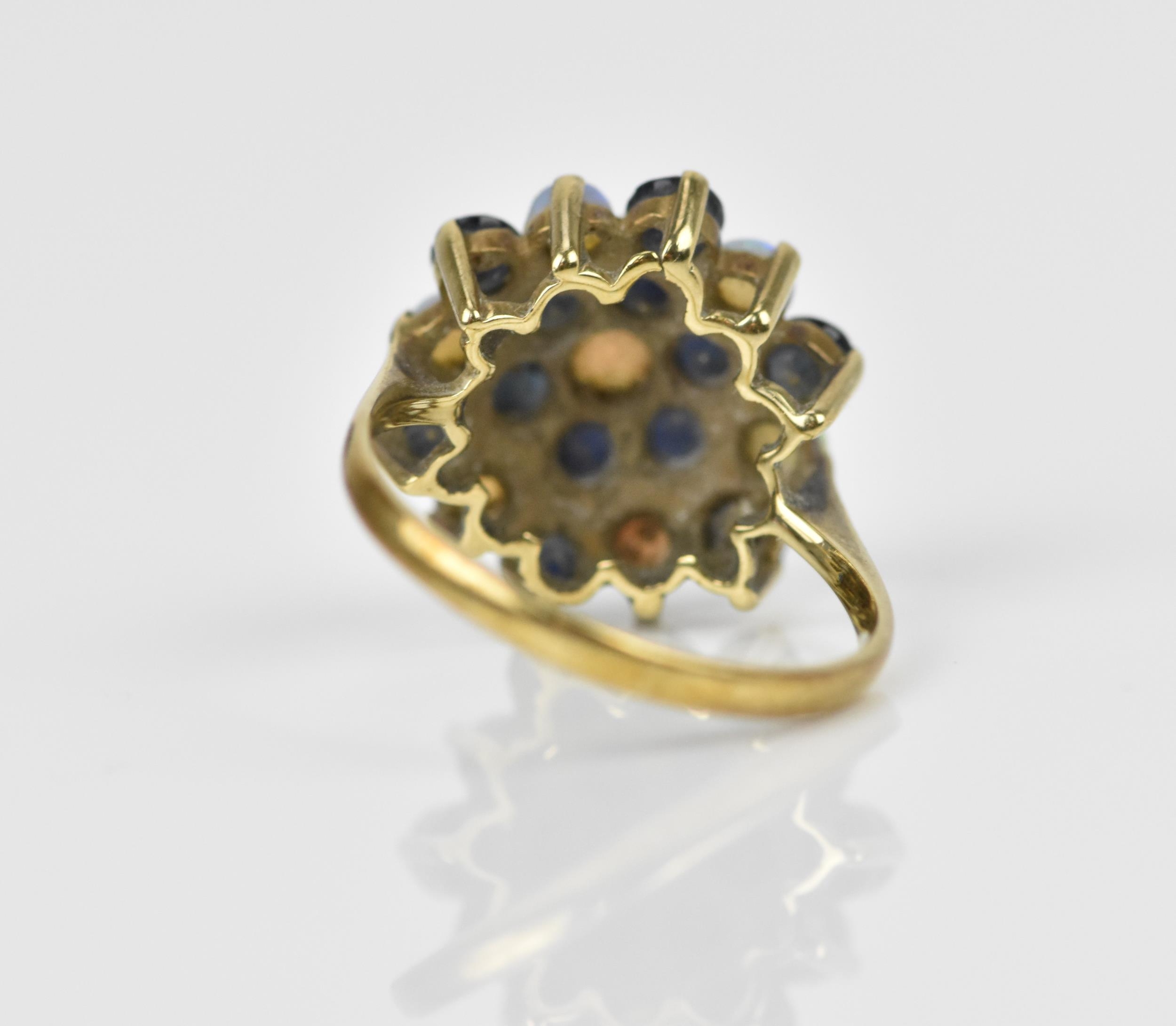 A yellow metal, blue sapphire and water opal dress ring, with cluster design of alternating cabochon - Image 3 of 4