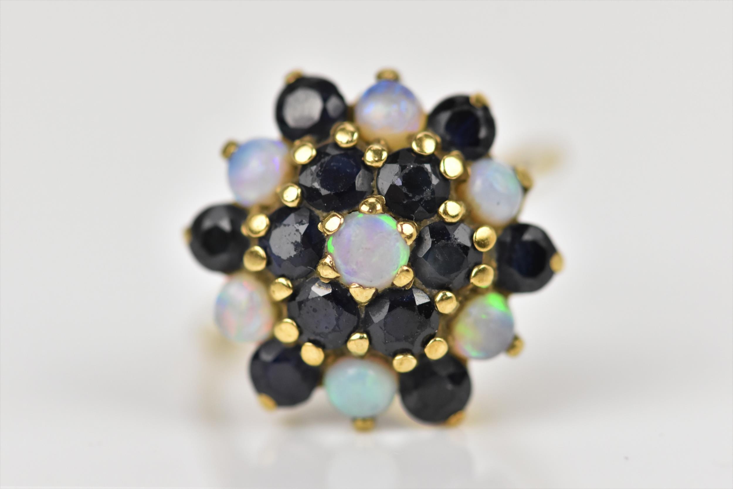 A yellow metal, blue sapphire and water opal dress ring, with cluster design of alternating cabochon - Image 4 of 4