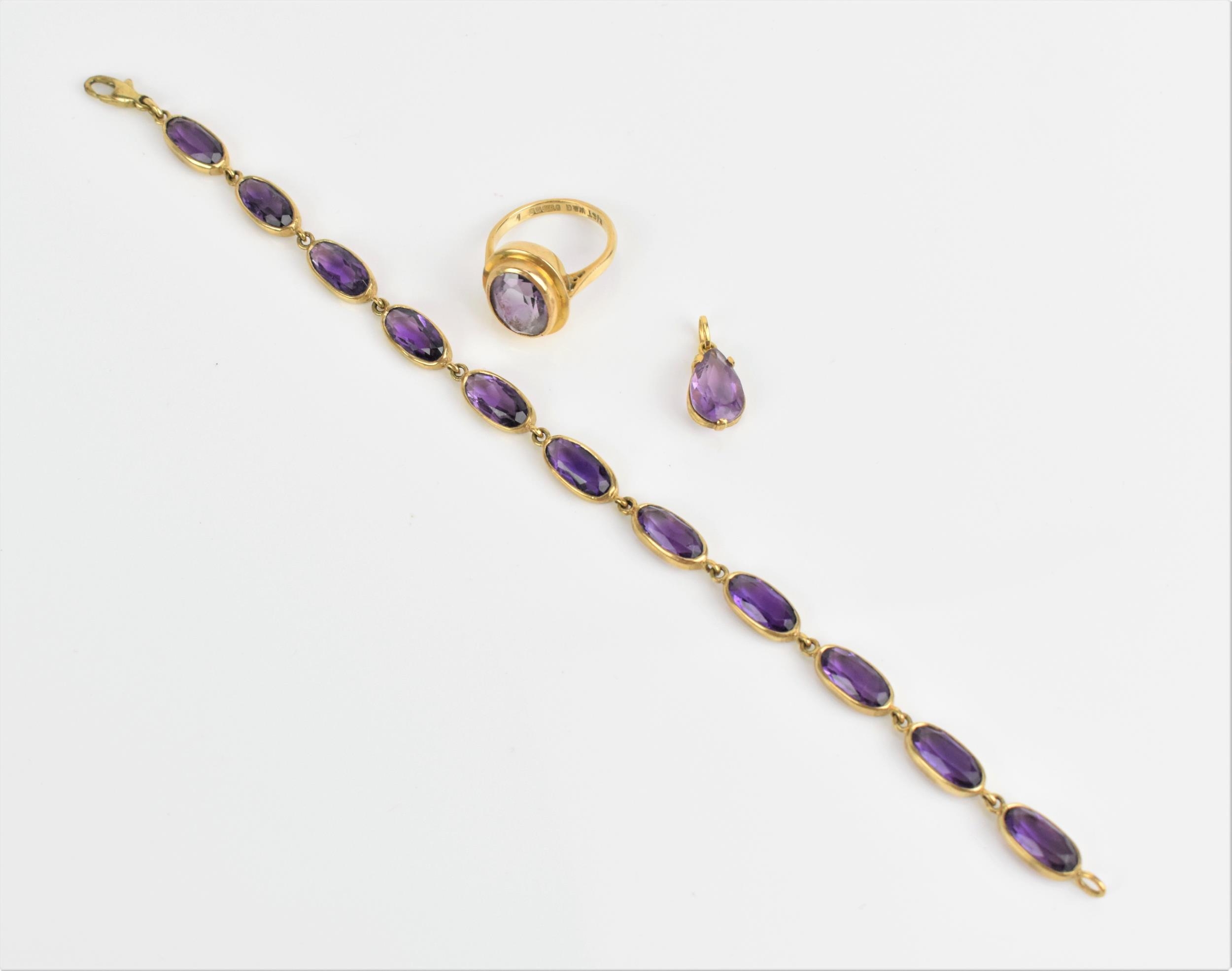 A 9ct yellow gold and amethyst bracelet, the stones in spectacle setting, linked with hoops and