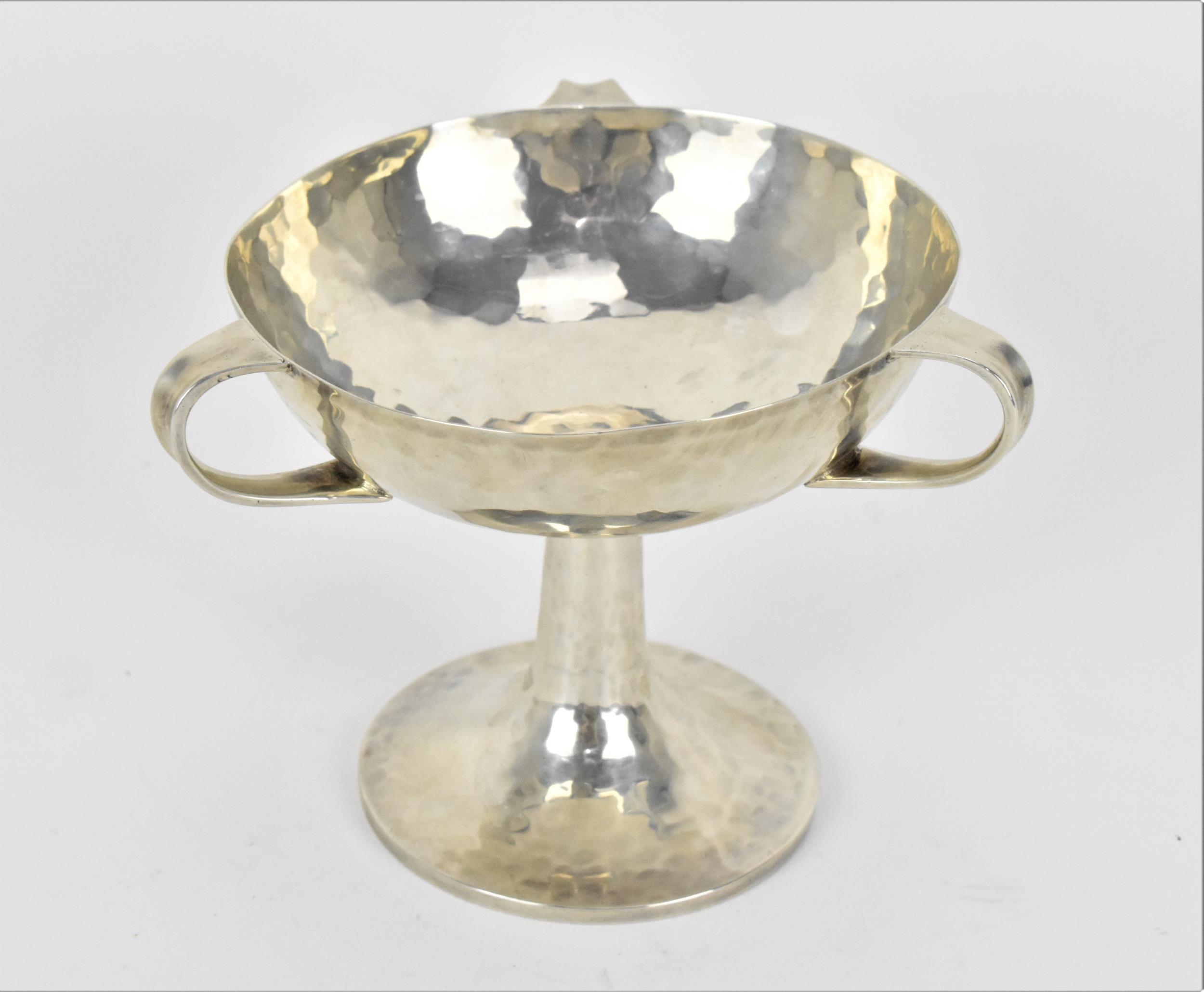 An Edwardian Art Nouveau silver hammered bowl on stand by William Hutton & Sons, London 1906, with