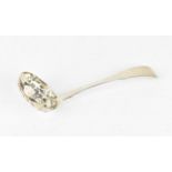 A George III silver sifting spoon by William Sumner I, London 1802, 15 cm long, weight 47 grams