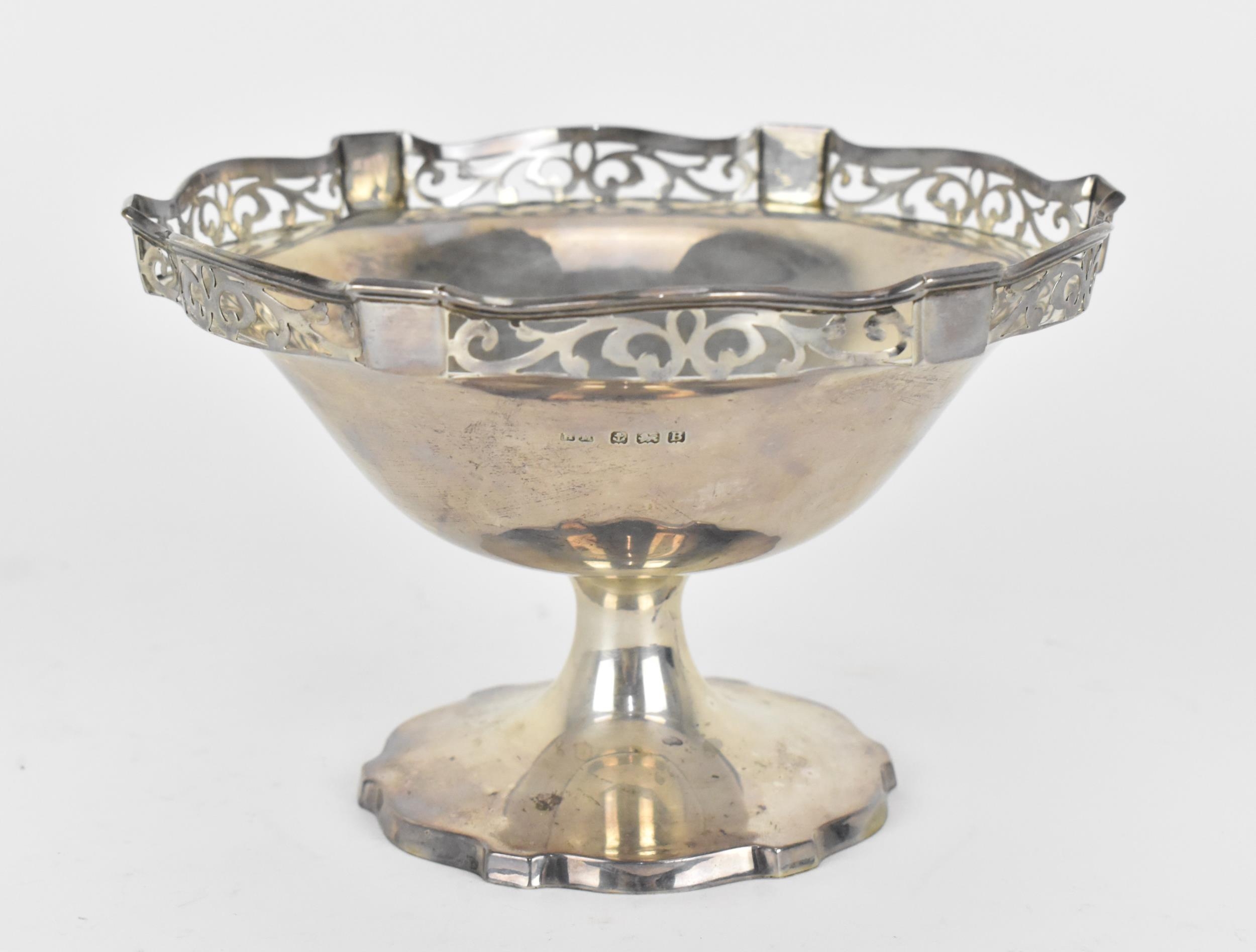 A George V silver bonbon dish on stand by Henry Matthews, Birmingham 1926, with pierced gallery