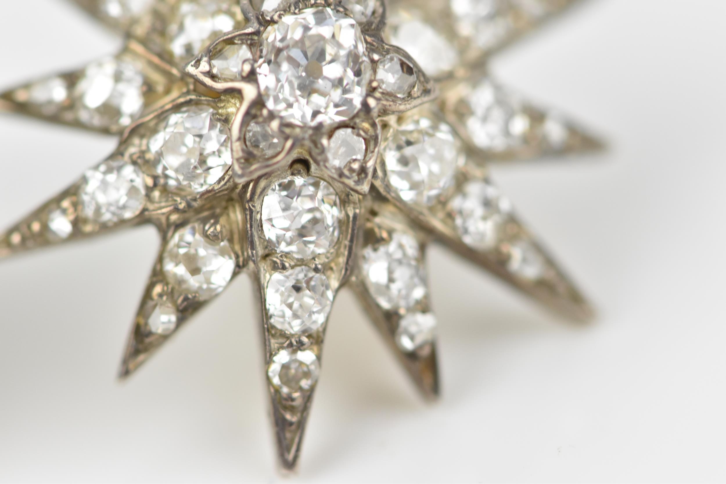 A pair of early 20th century white metal and diamond starburst earrings, set with old mine cut - Image 5 of 9