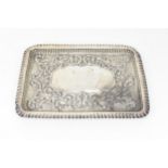 An Edwardian silver tray by Sydney & Co, Birmingham 1903, of rectangular form with pinched rim,